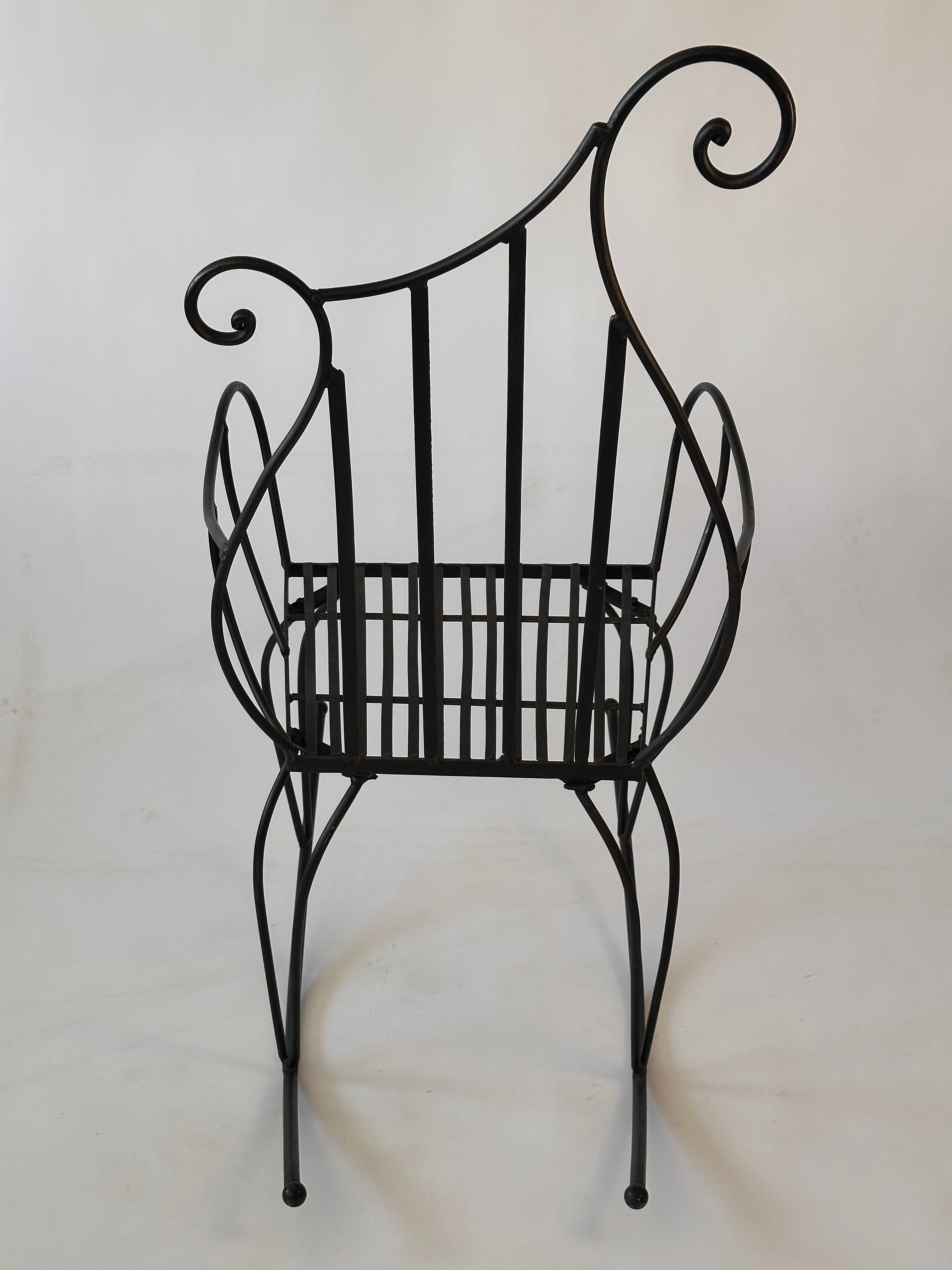 Chaise à bascule artisanale en fer forgé